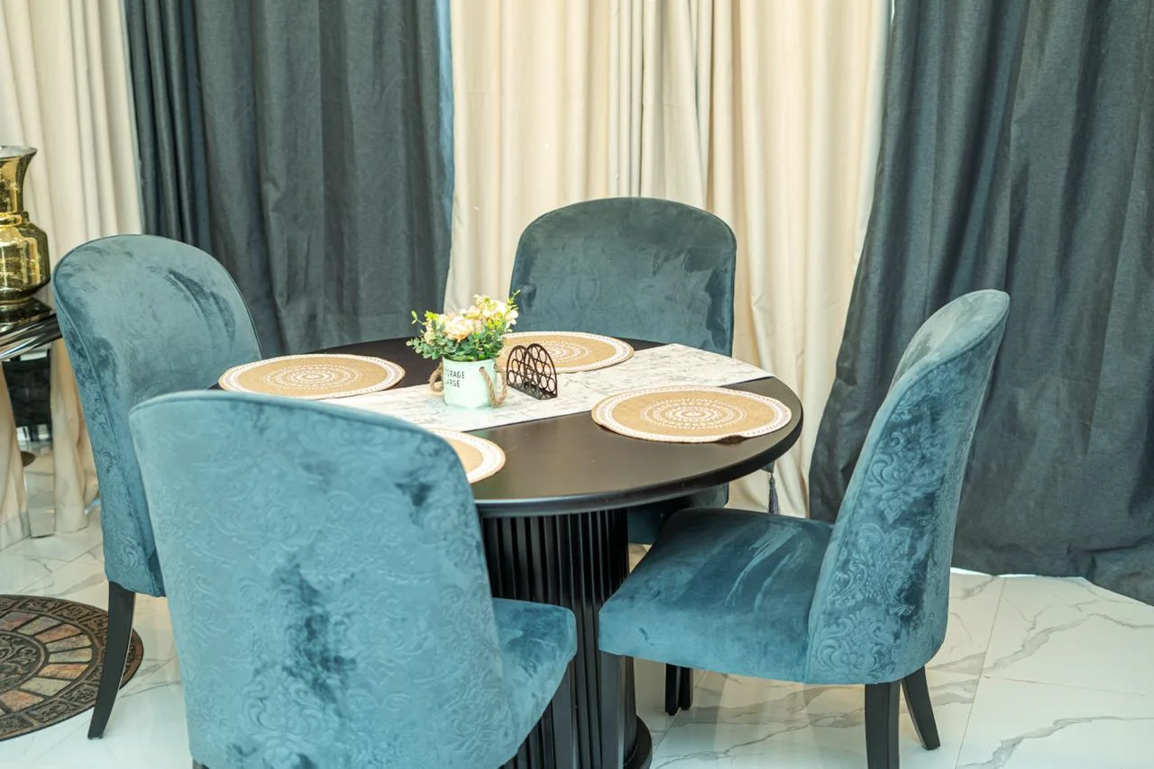 Dining table and blue upholstered chairs